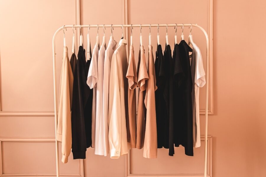 A curated rail of stylish neutral clothes