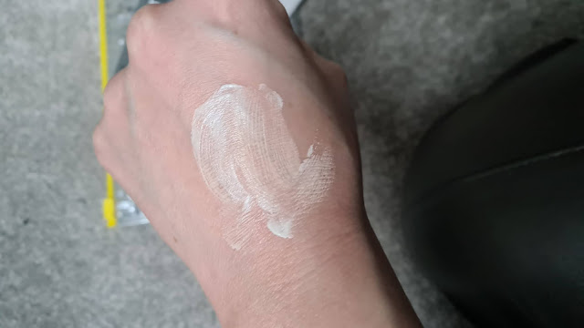 The back of a woman's hand showing the partially blended dot of Trinny London BFF Cream SPF 30